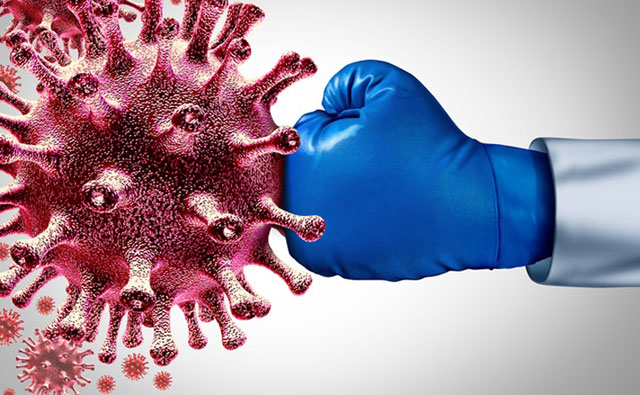 Viruses get punched by a fist covered with a boxing glove